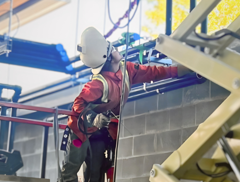 working welding large pipes together